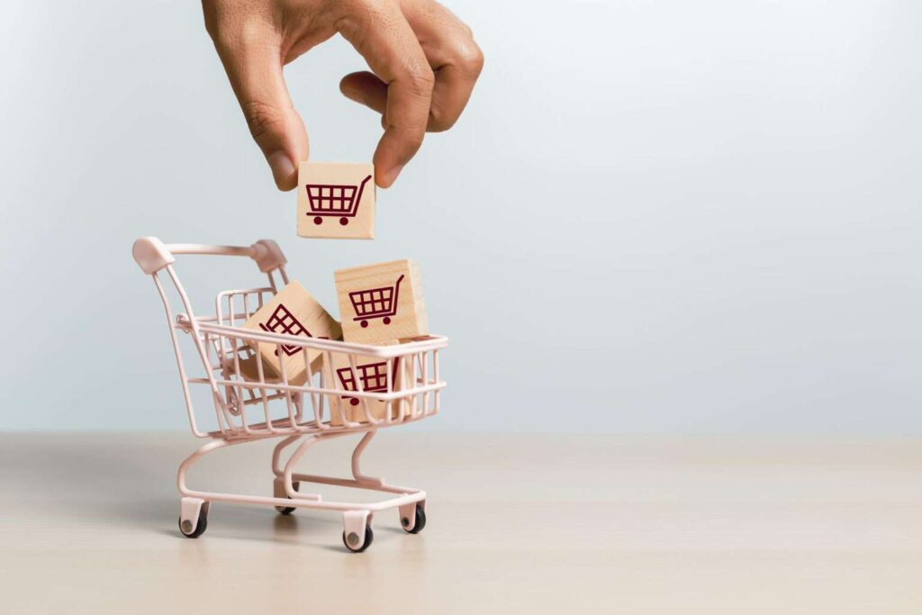 online shopping delivery market concept hand holding wooden cubes block with shopping cart icons shopping trolley sell marketing purchase delivery 1536x1024 1